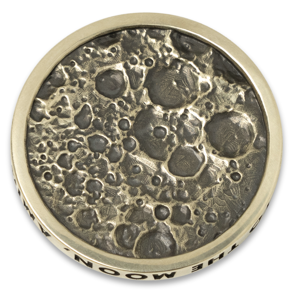 Brass coin with moon surface design on a white background. made for Moon Crew Members