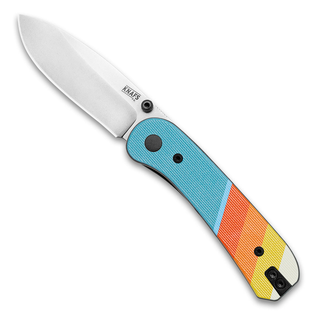 Knafs Lander 1 Pocket knife with Good Vibes scales, opened front side with a D2 silver stone washed blade, lying flat on a white background at a 45 degree angle 