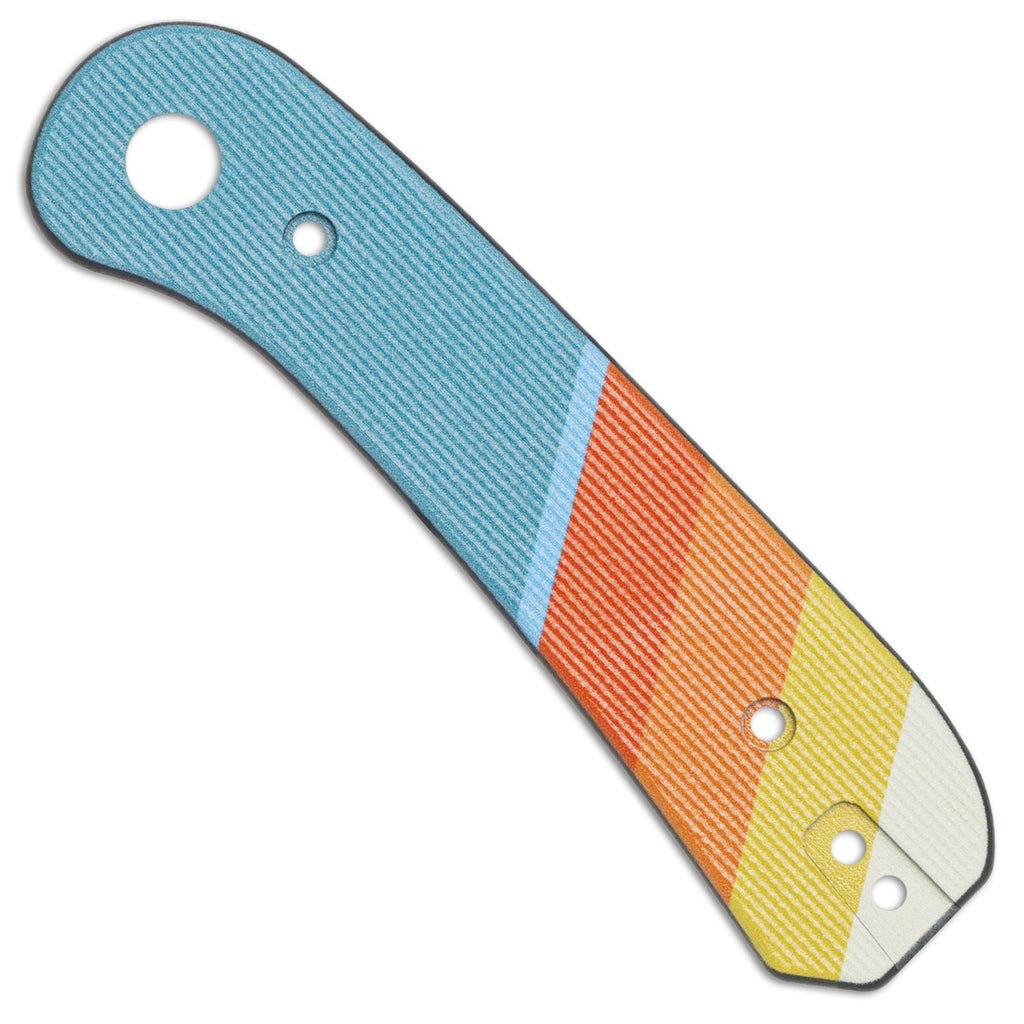 A single lander 1 scale of blue, orange, yellow, and off-white pocket knife scales on a white background.