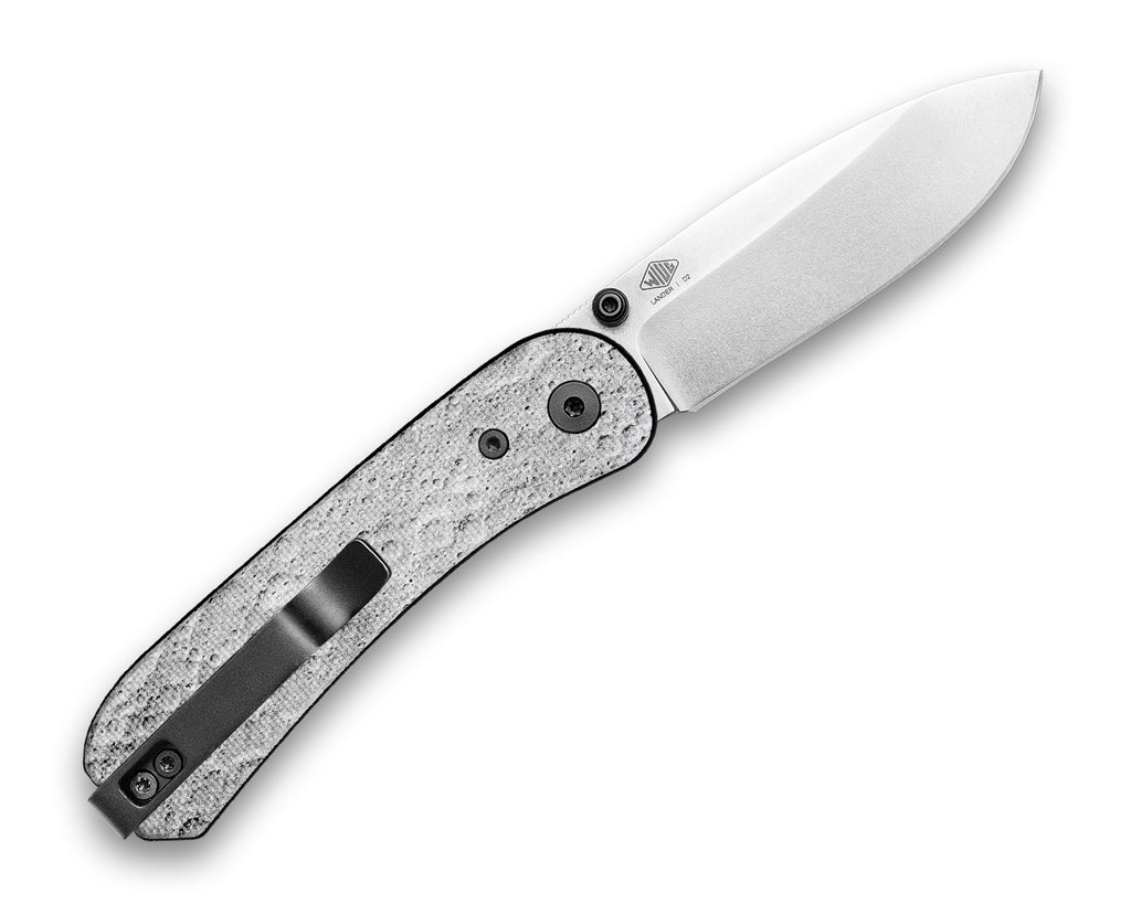 Opened clip side of a Knafs Lander 1 Pocket Knife with a Lunar Surface G10 handle and a Stonewashed D2 drop point blade
