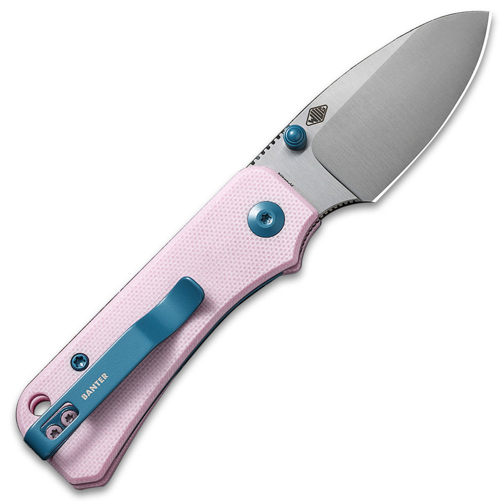 Opened clip side of a CIVIV Baby Banter Pocket Knife with Powder Pink G10 scales and a Satin Nitro V flat grind drop point blade