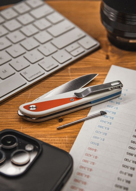 Knafs Doodler knife with the hidden micro pen deployed on a desk