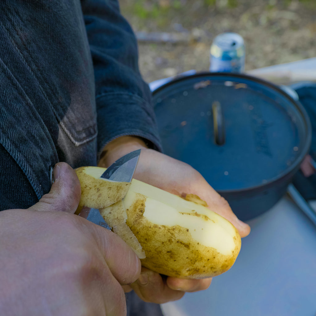 Knafs Lulu fixed blade knife slicing peeling a potato in hand